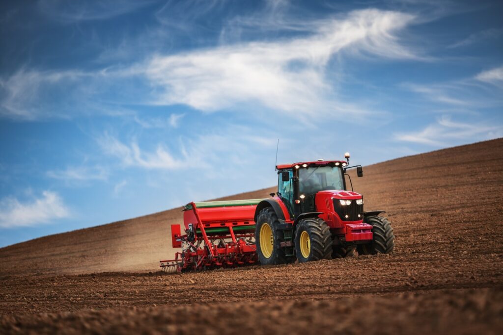 Tractor Driving Planting Seeds